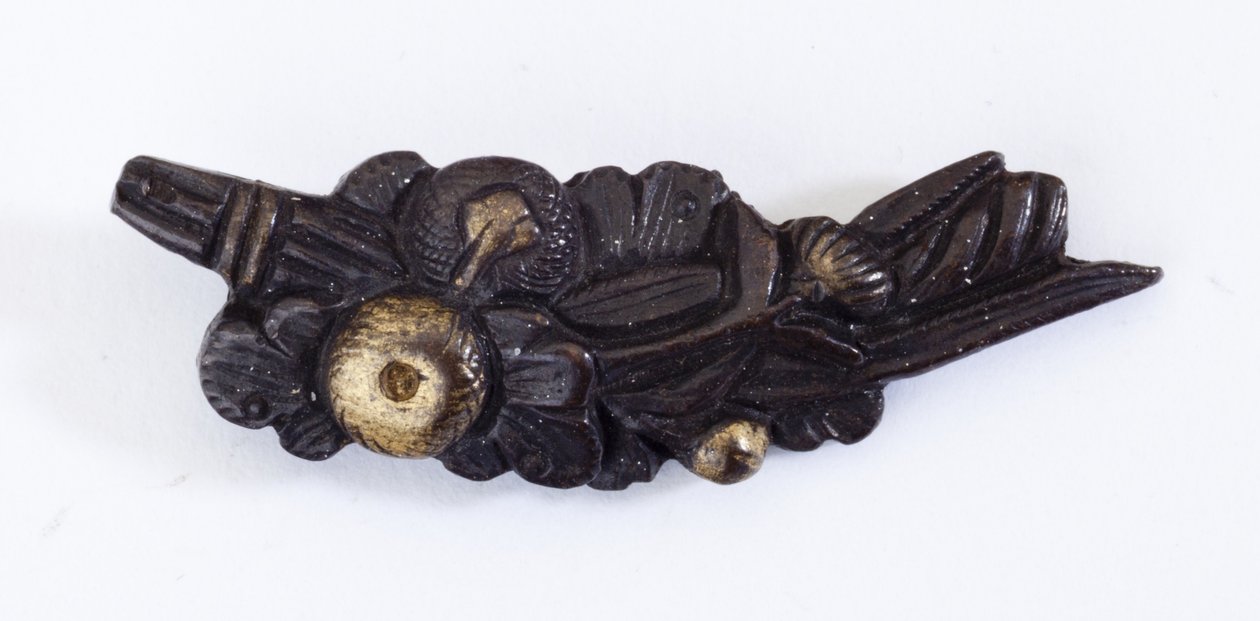 Menuki, or grip ornament, in the shape of a floral arrangement by Japanese School