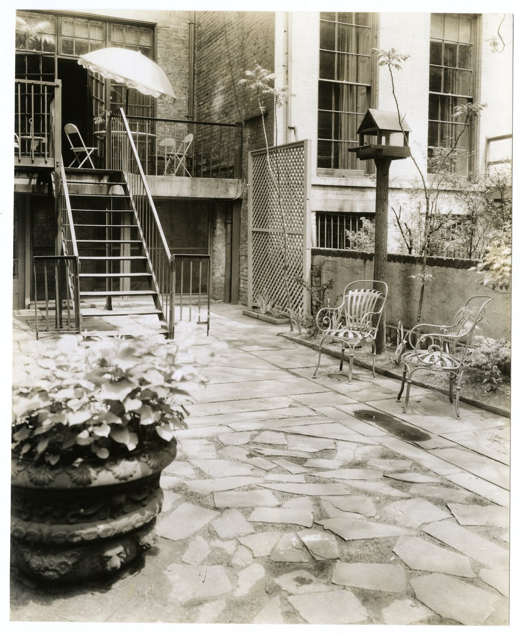 Backyard patio with bird house, New York, USA, c.1905-40 by Jessie Tarbox Beals