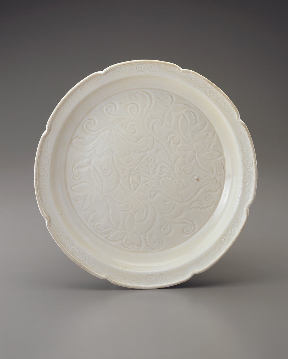 Dish with foliate rim and carved decoration by Jin Dynasty Chinese School
