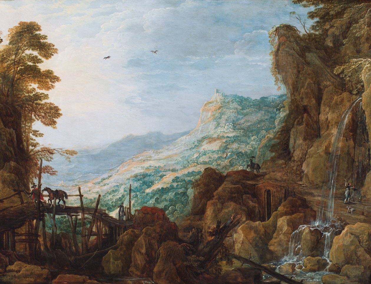 A Rocky Mountainous Landscape with a Horseman on a Bridge and a Waterfall by Joos or Josse de The Younger Momper