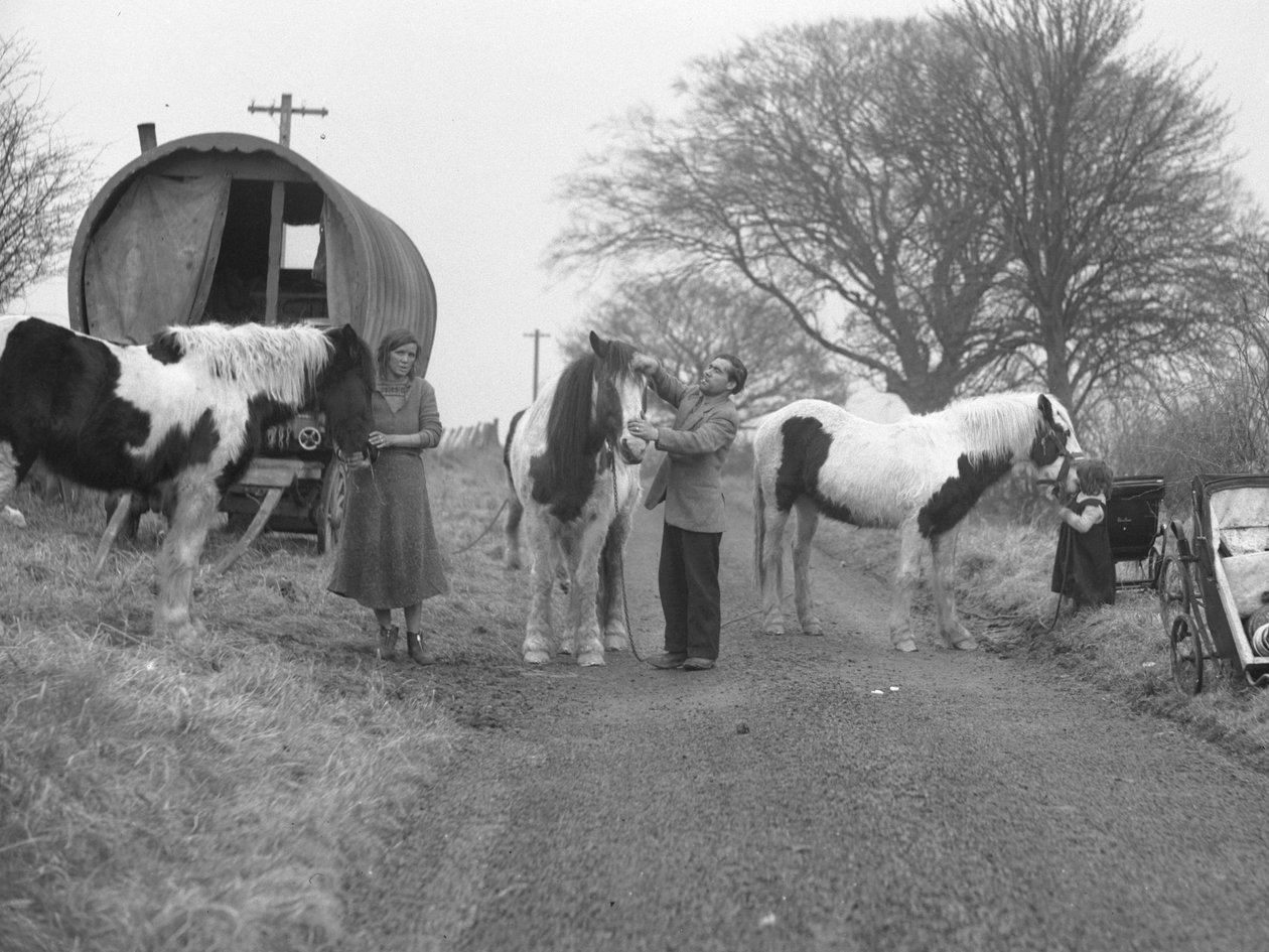 Hooped van on verge of road with gypsies and horses by Joseph Hardman