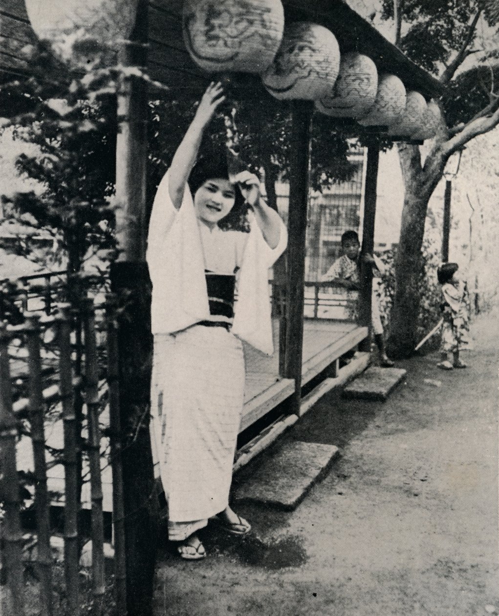 Sweet natured smile of tea-house maid, called nesan - elder sister by Julian Leonard Street