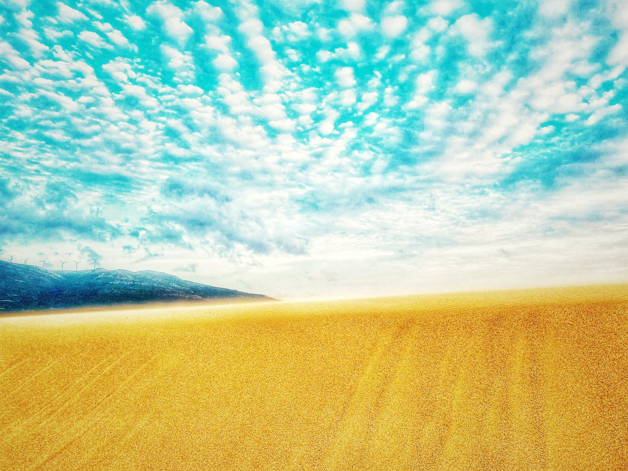 Surreal Desert Beach in Mountain Range by Katha Wood