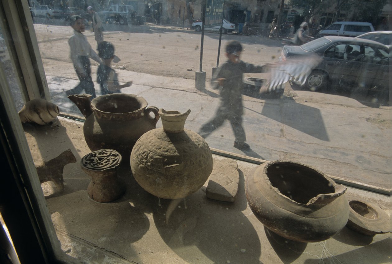 Afghanistan, Herat, antiquities for sale, window display, street scene, 2004 by Kenneth Garrett