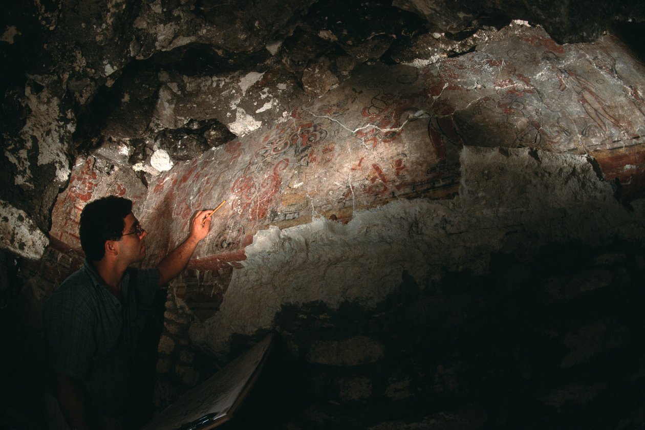 William Saturno inspects mural; San Bartolo; Guatemala; Maya by Kenneth Garrett