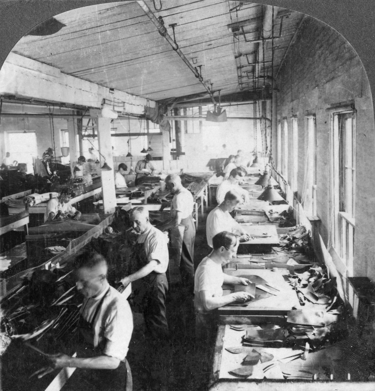 Workers Cutting Leather for Shoes in a Factory, Lynn, Massachusetts, USA by Keystone View Company