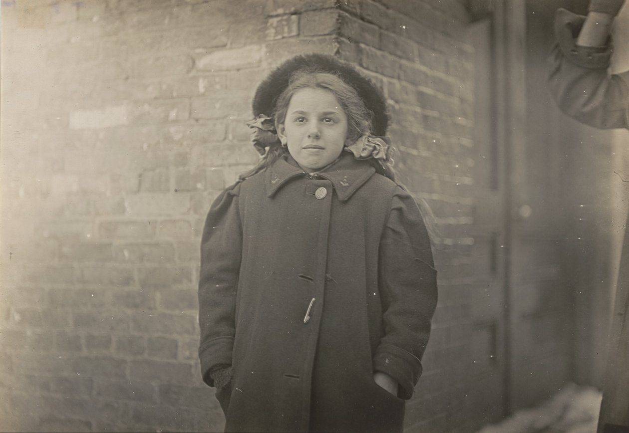 Mery Horn, a hunchback condition aggravated by the heavy load of papers she carried. Hartford, Connecticut, March 1909 by Lewis Hine
