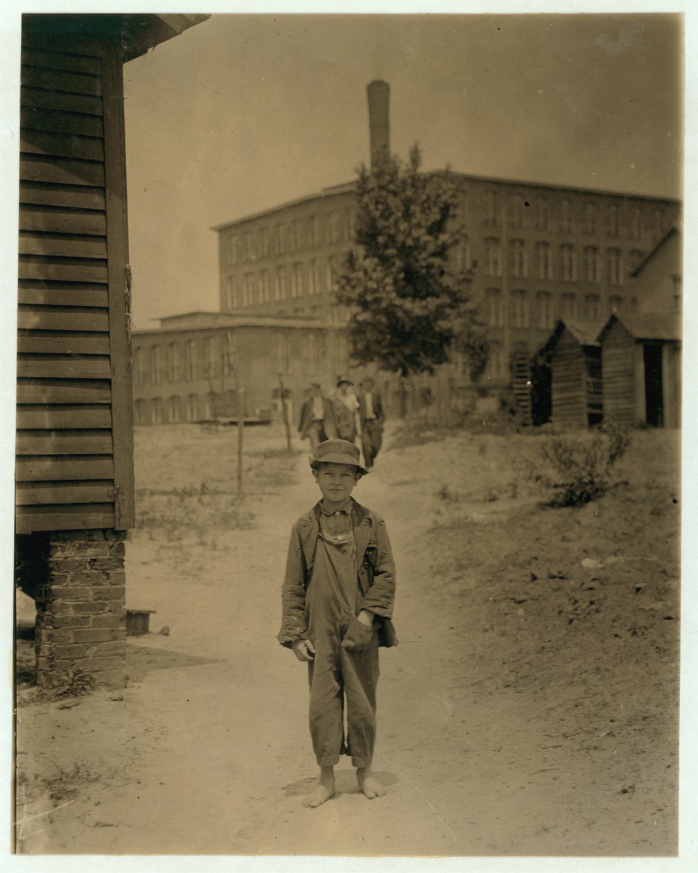 12 year old Eddie Norton, makes about 40 cents a day as a sweeper at Saxon Mill, Spartanburg, North Carolina by Lewis Wickes Hine