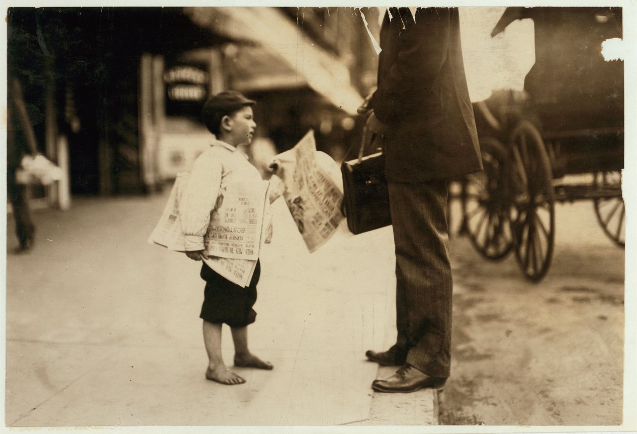 6 year old newsboy Hyman selling papers until 6 p.m. in Lawrence, Massachusetts, 1911 by Lewis Wickes Hine