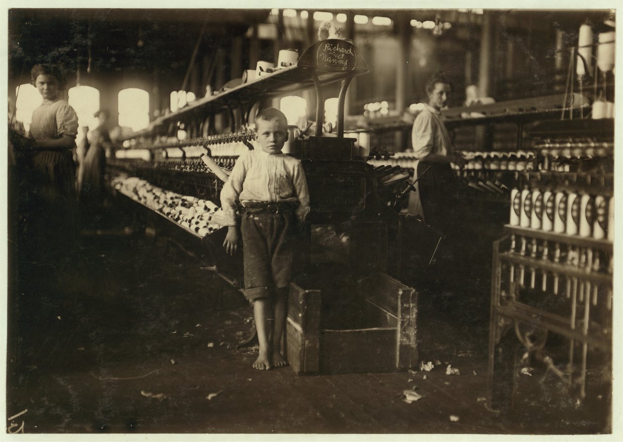 8 Year Old Leo, Only 4 Feet Tall, Picks Up Bobbins for 15 Cents a Day at Elk Cotton Mills, Fayetteville, Tennessee, 1910 by Lewis Wickes Hine