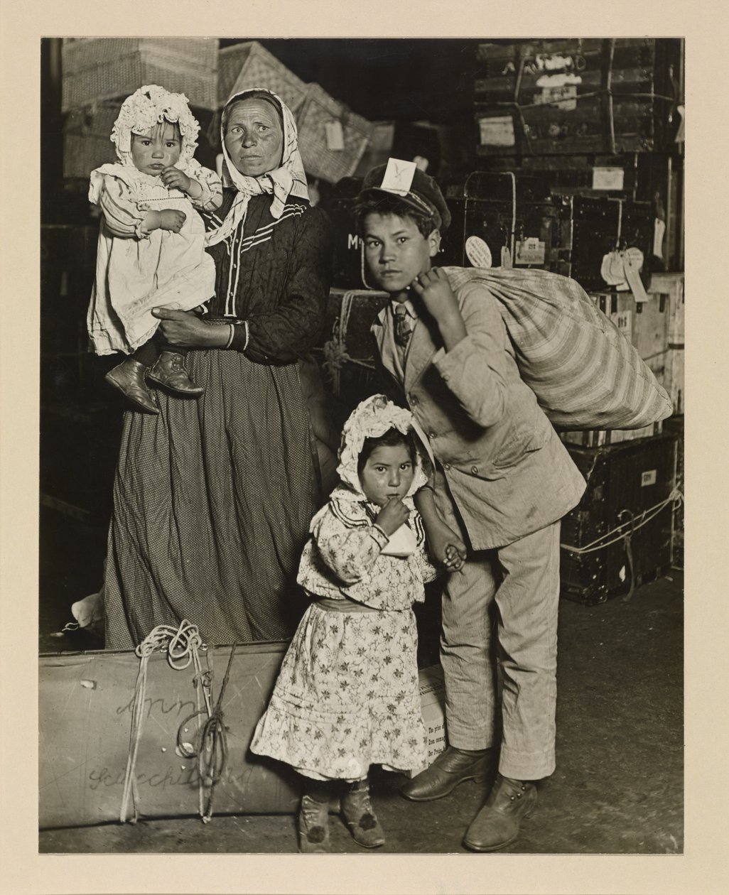 Italian Family Looking for Lost Baggage, Ellis Island by Lewis Wickes Hine
