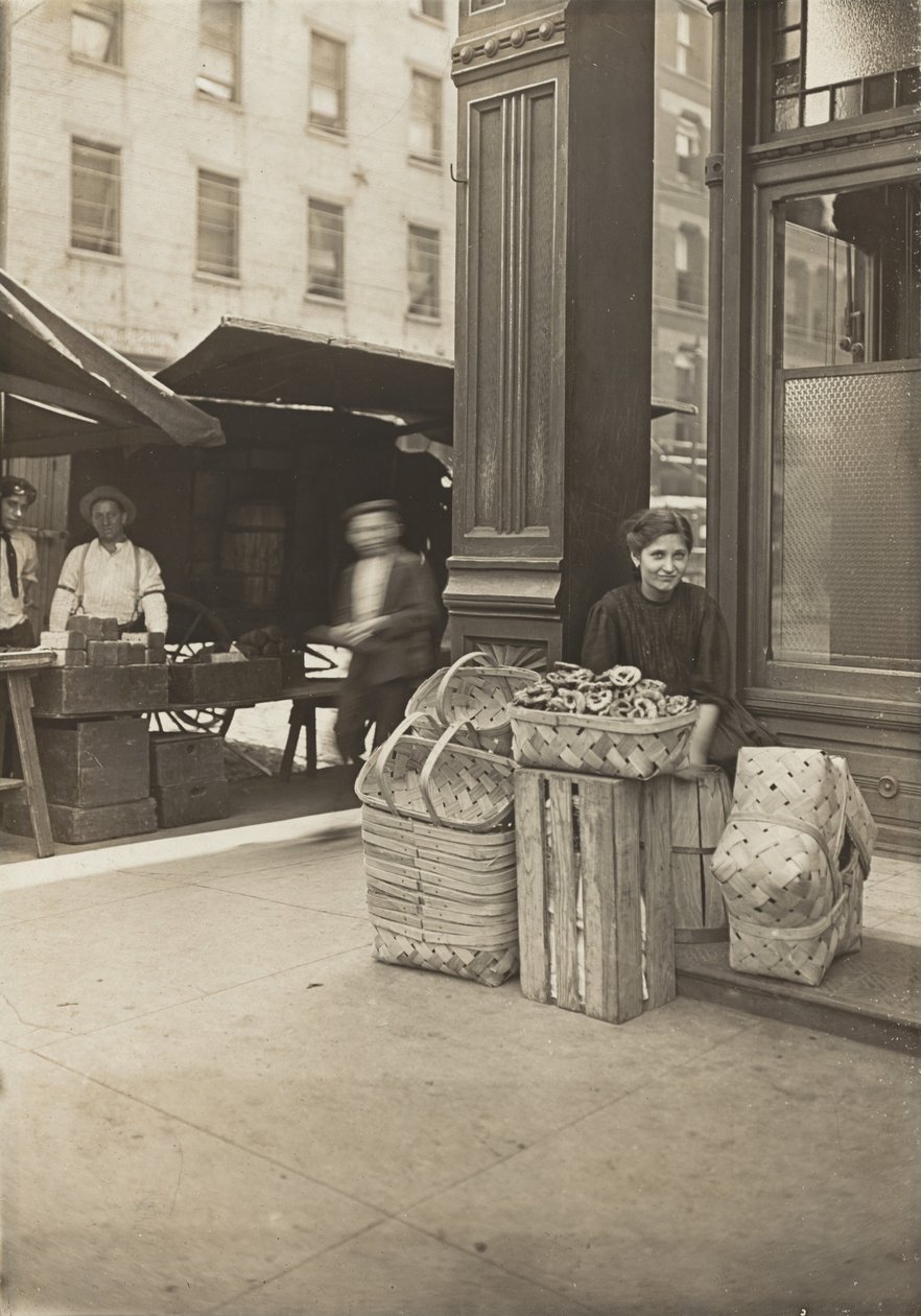 Lena Lochiavo - 11 years old, basket and pretzel seller, at Sixth Street Market in front of saloon by Lewis Wickes Hine