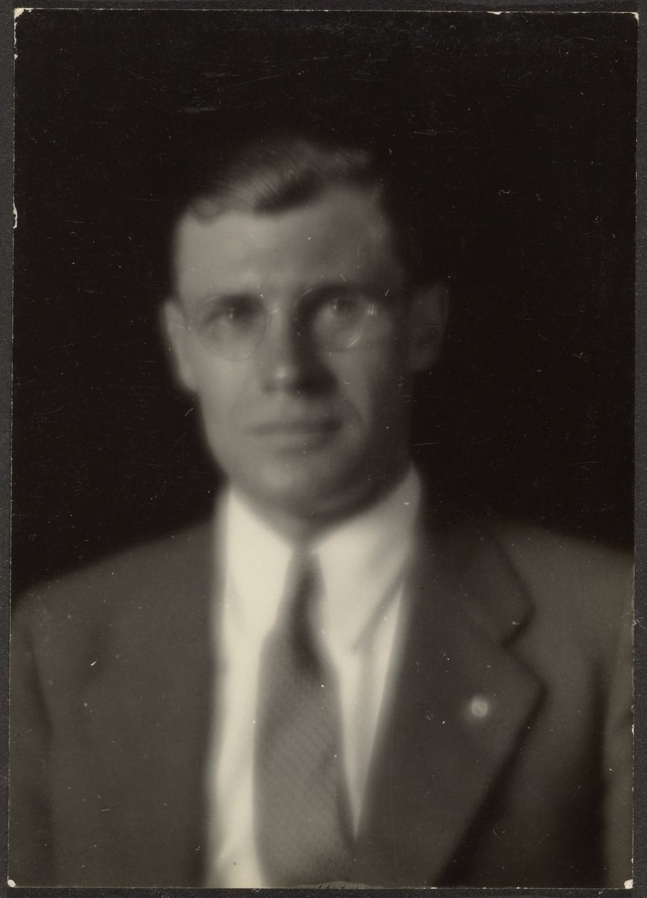Portrait of a Man with Glasses and Lapel Pin by Louis Fleckenstein