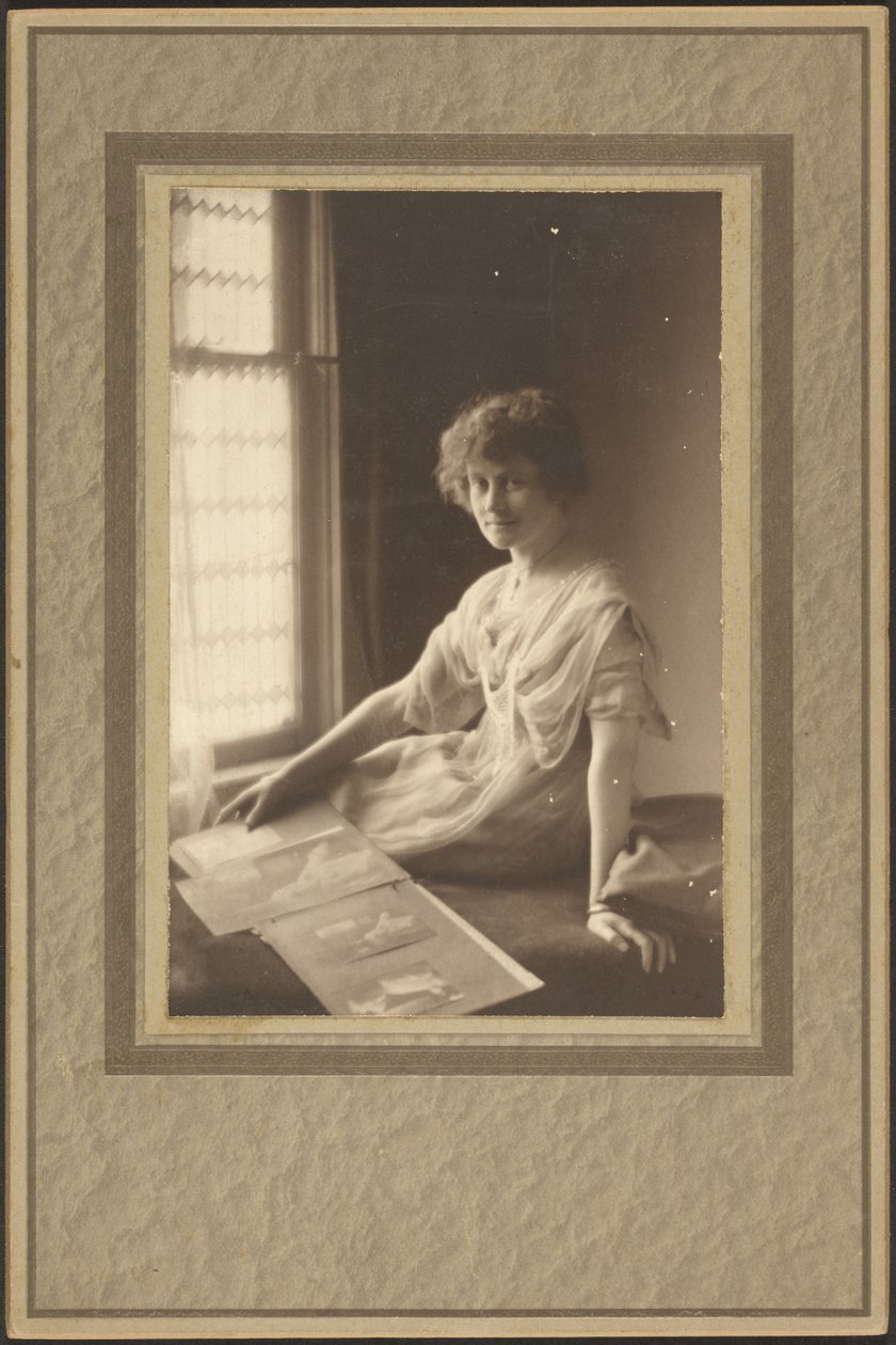 Portrait of a Woman Looking at Album by Louis Fleckenstein