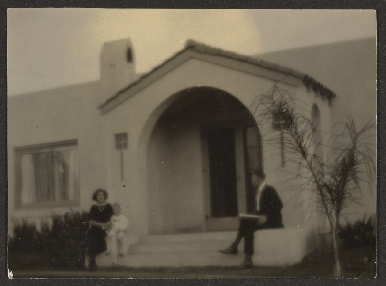 Woman and Man in Front of a House by Louis Fleckenstein