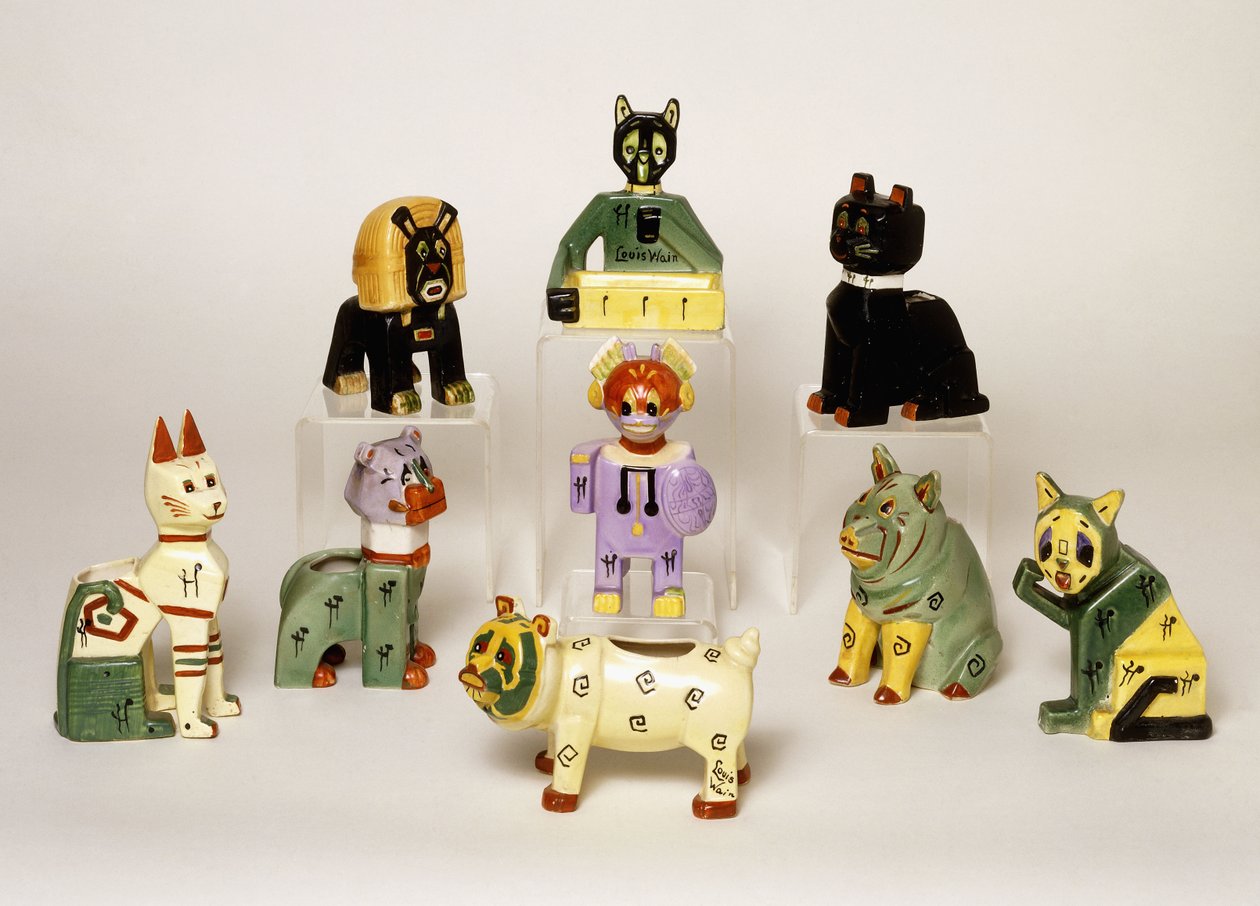 A Group of Porcelain Vases Shaped as Stylised Animals by Louis Wain