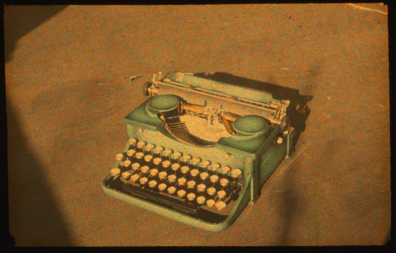 Still life color photograph of a typewriter taken with Autochrome Lumière and a 35mm camera by Luis Marden