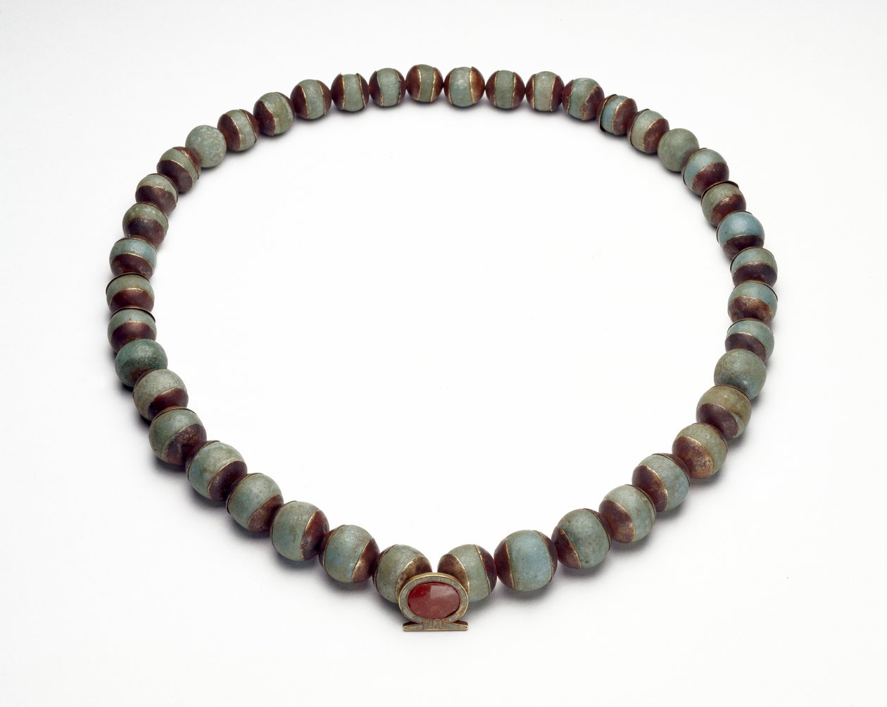 Faience Cylinder and Necklace with Gold, Turquoise and Carnelian Pendant in the Shape of a Shen-Ring, the Sign for Eternity by Middle Kingdom Egyptian