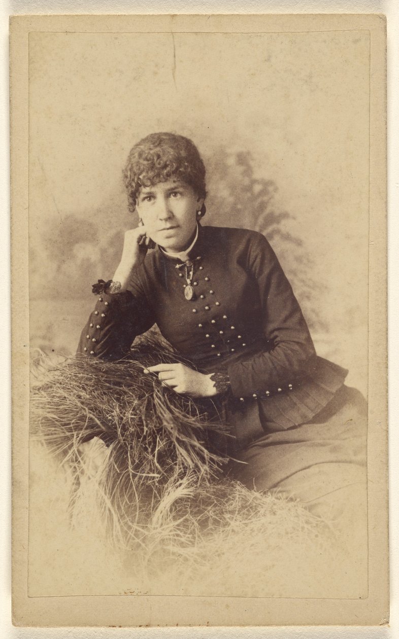 Unidentified Woman Seated with Hand on Cheek, Posed on a Pile of Hay by Miller and Company