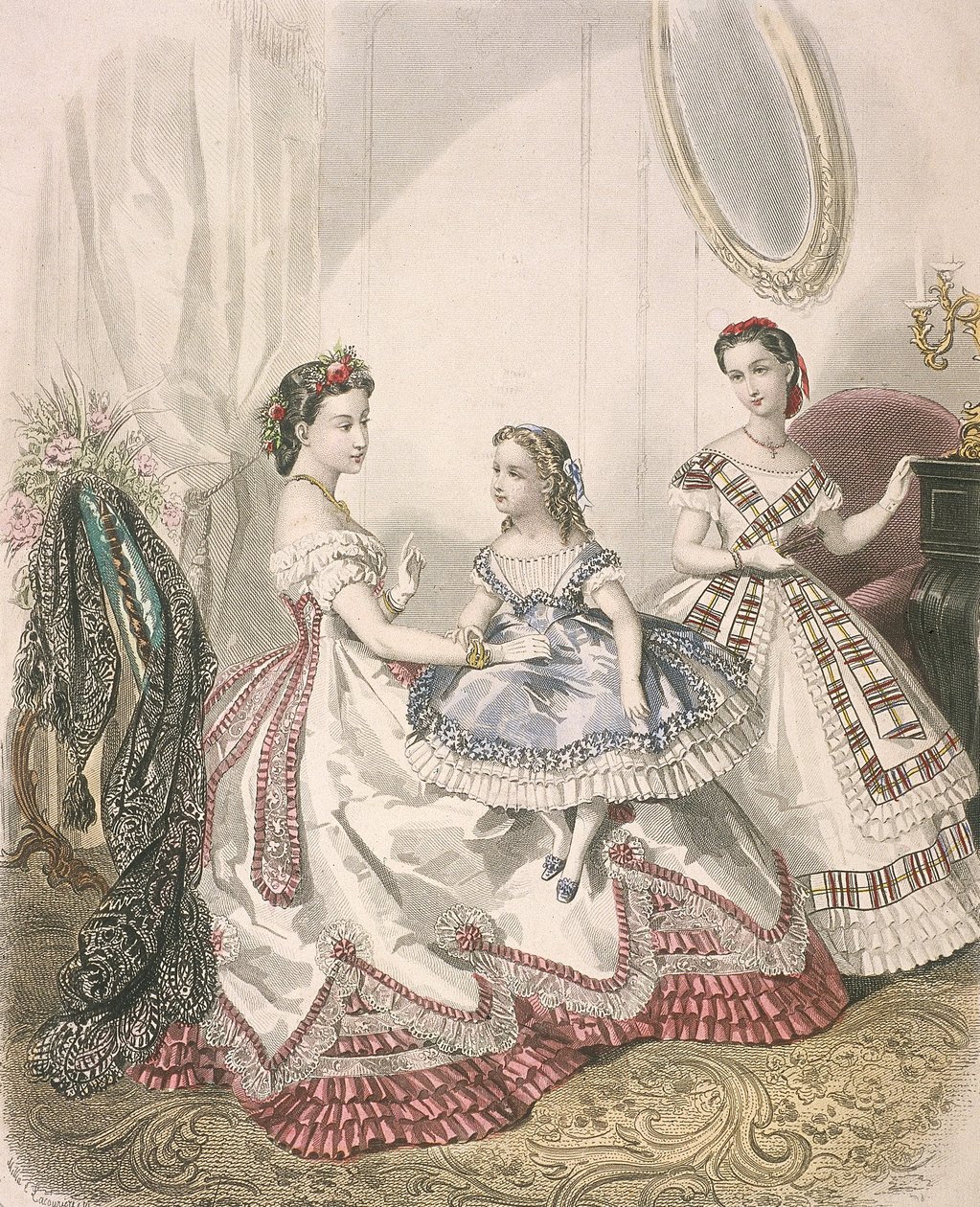 Two women and a small girl wearing the latest indoor fashions by Millia Lacouriere