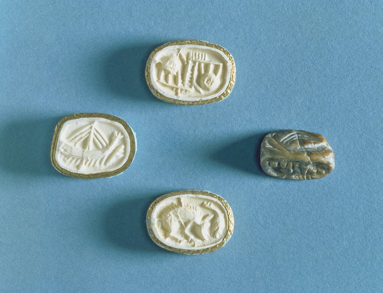 Seal with three impressions from Knossos, early Minoan by Minoan