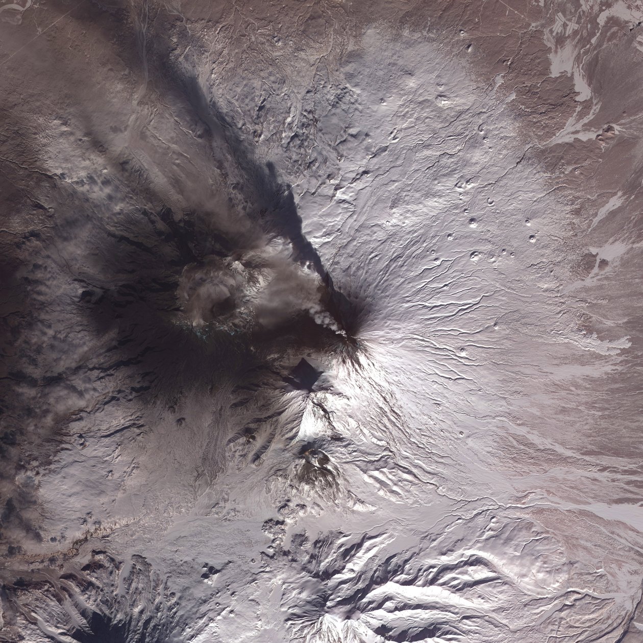Satellite image of eruption of Kliuchevskoi or Klyuchevskaya Sopka volcano, Kamchatka Peninsula, Russia, 2010. Has been active almost continuously since its first recorded eruption in 1697 by National Aeronautics and Space Administration National Aeronautics and Space Administration