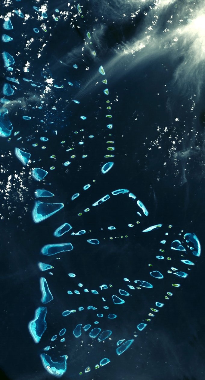 Satellite view of North and South Malosmadulu Atolls in the Maldives, northern Indian Ocean, southwest of India, made up of a chain of 1,192 small coral islands by National Aeronautics and Space Administration National Aeronautics and Space Administration