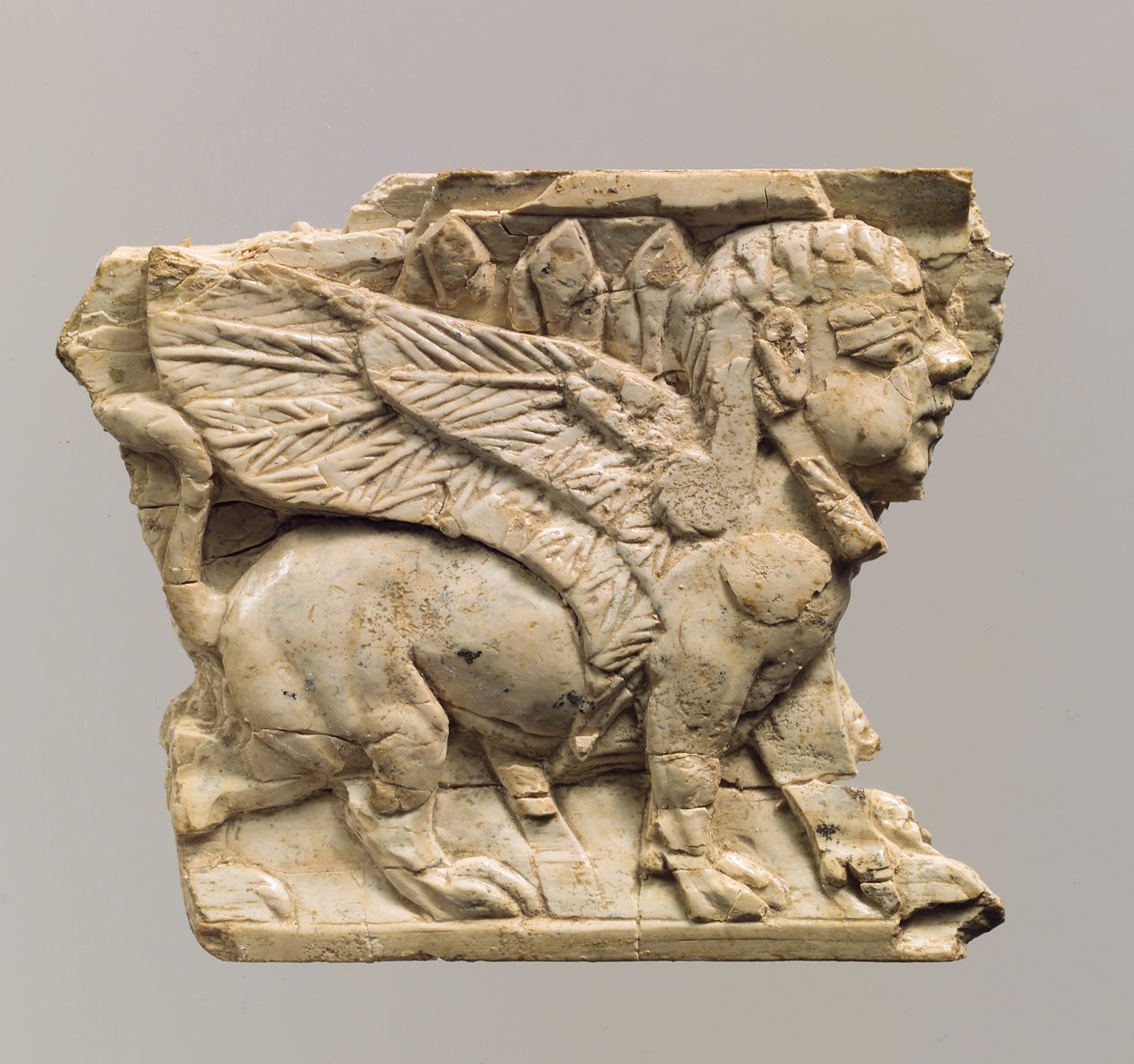 Furniture Plaque Carved in Relief with Sphinx by Neo Assyrian