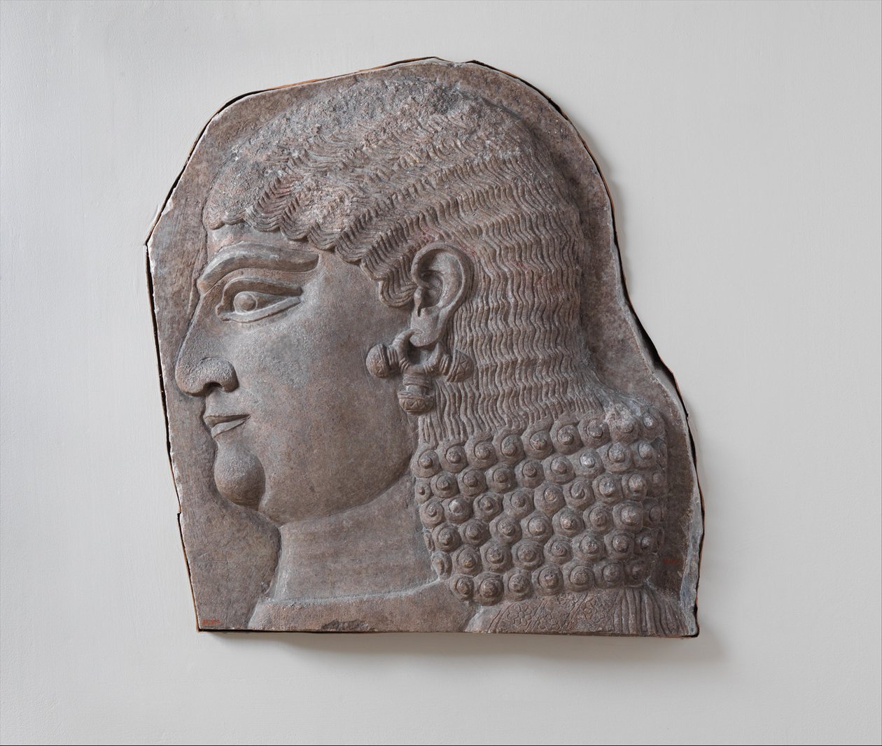 Head of a beardless royal attendant, possibly a eunuch by Neo Assyrian Neo Assyrian