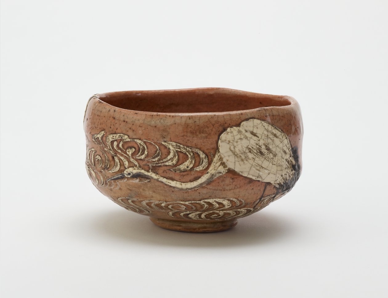 Kenzan style tea bowl with design of crane and flowing water, late 19th century by Ogata (style of) Kenzan
