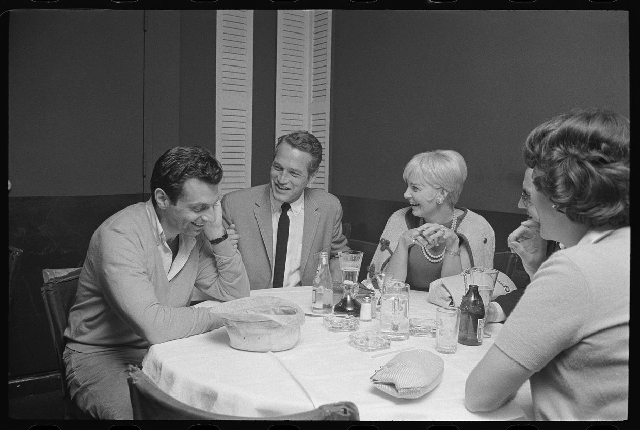 Paul Newman, Mort Sahl and Joanne Woodward joking at dinner by Orlando Suero