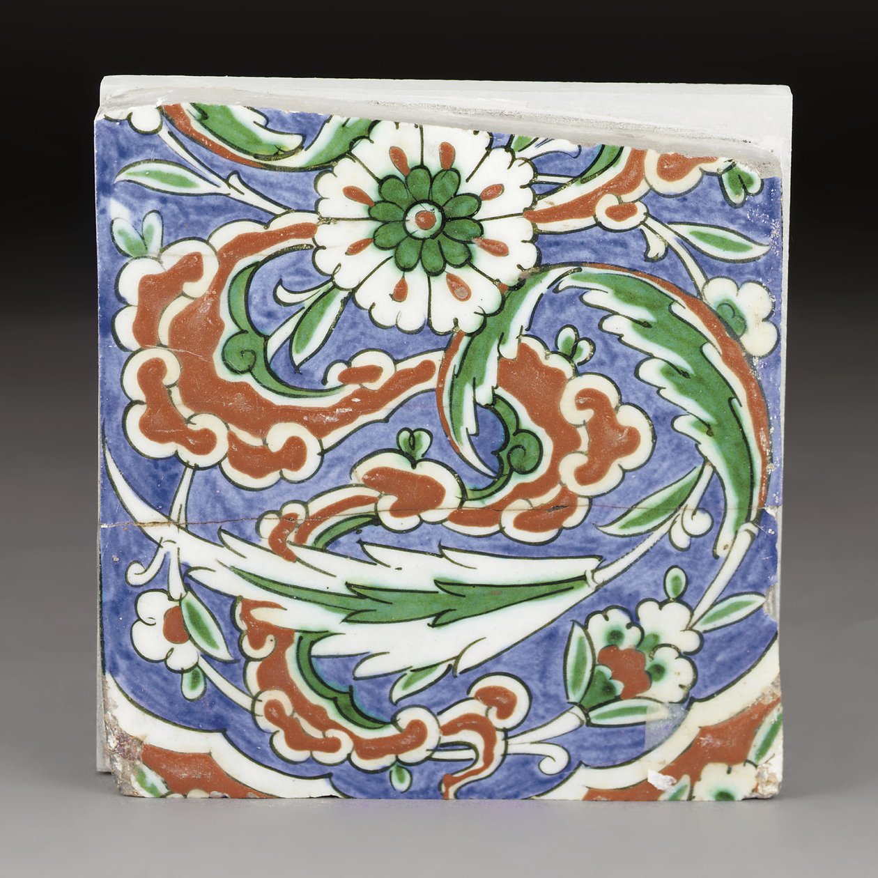 A partial Iznik pottery tile, Ottoman Turkey by Ottoman School