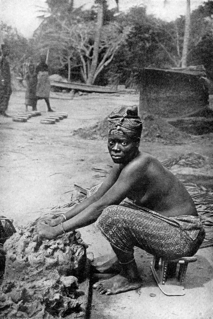 A Gold Coast potter and her clay, Ghana, West Africa, 1922 by P. A. McCann