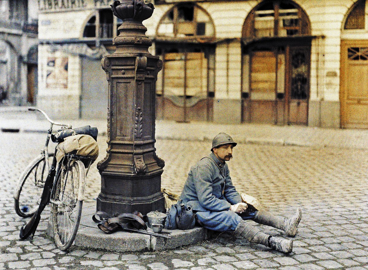 A soldier in Reims with his bicycle, France, April 1, 1917 by Paul Castelnau