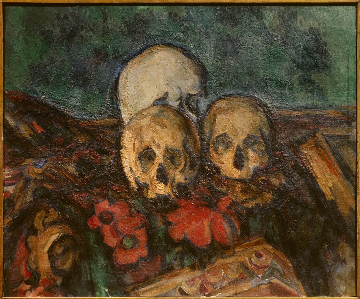 Three skulls on an oriental rug by Paul Cézanne