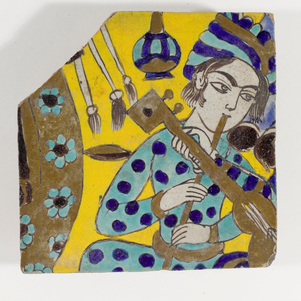Safavid Persia Pottery Tile Depicting a Man Playing a Flute by Persian School