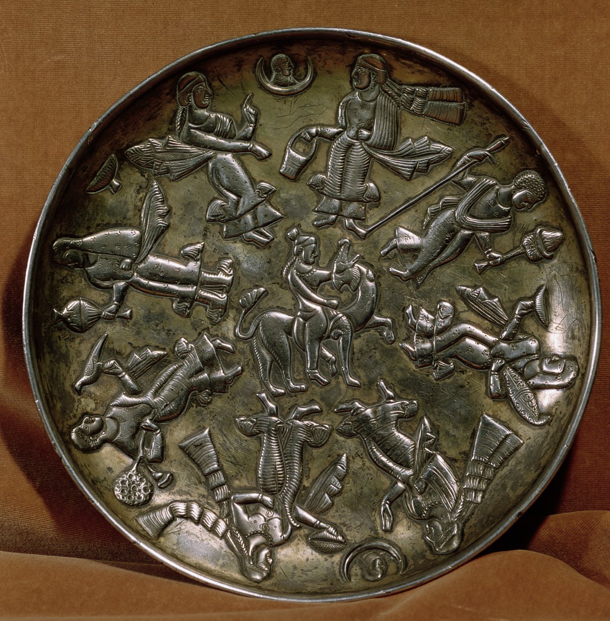 Dish with relief decoration depicting the goddess Anahita surrounded by eight female figures by Persian School