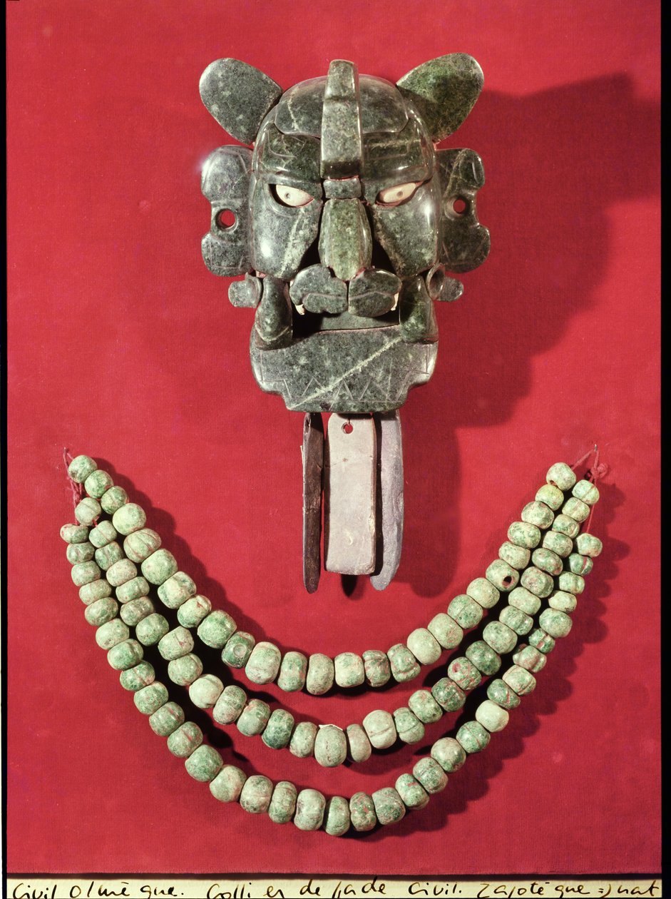 Zapotec pectoral in the form of a mask representing the bat god, Piquete Zina, from Monte Alban, Oaxaca and an Olmec necklace made from 90 gourd shaped beads, from La Venta, Tabasco by Pre Columbian