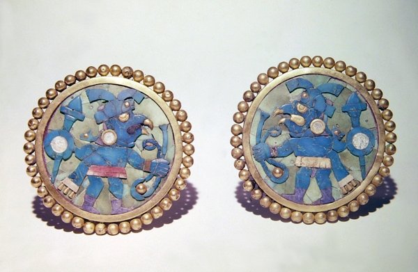 Ear disks decorated with bird-headed warriors carrying shields, spears and slings, Mochica style by Pre Columbian Pre Columbian