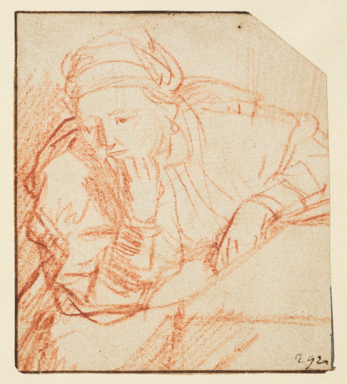 Saskia seated at a table by Rembrandt van Rijn