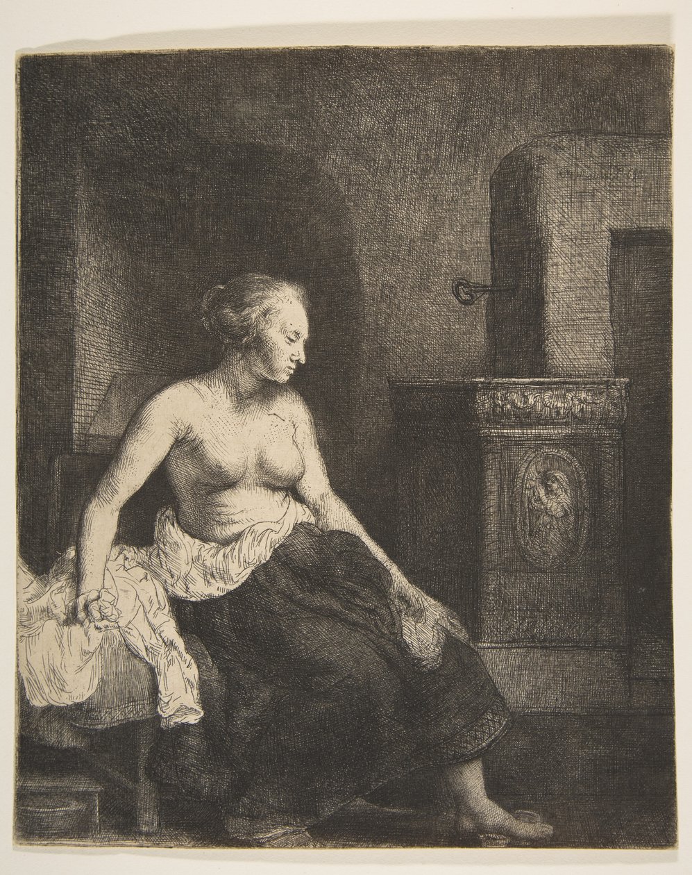 Woman Sitting Half-Dressed beside a Stove by Rembrandt van Rijn