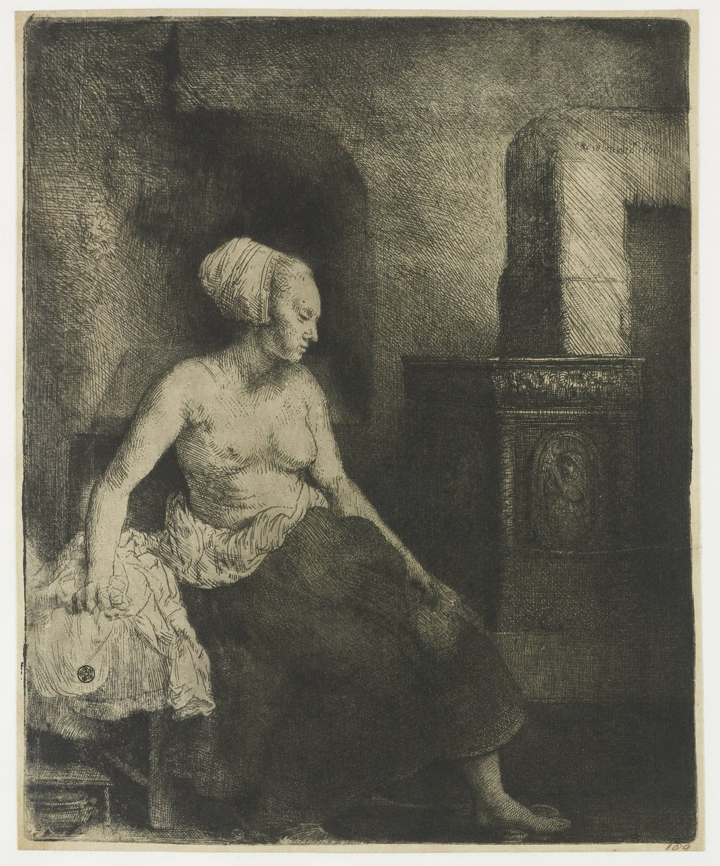 Woman sitting half dressed beside a stove by Rembrandt van Rijn