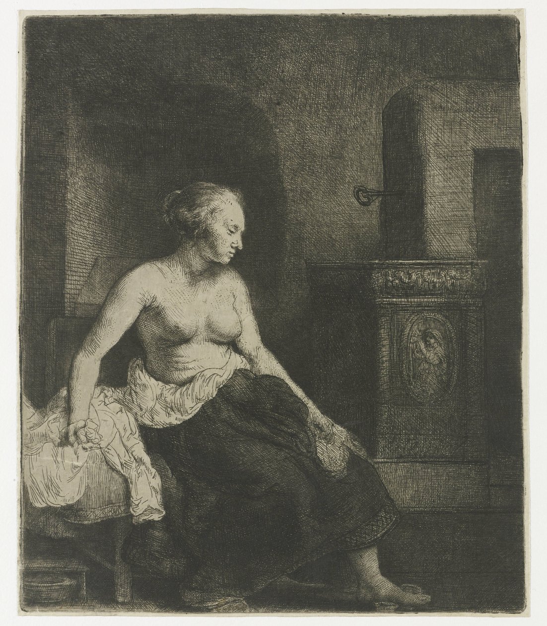 Woman sitting half dressed beside a stove by Rembrandt van Rijn