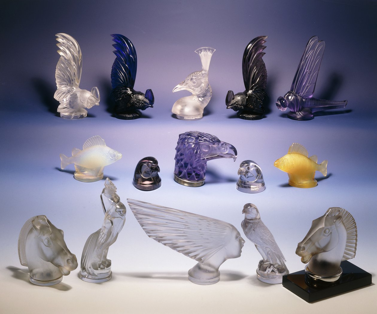 Various glass car mascots (of birds, fish, horses and a human head) by Rene Jules Lalique