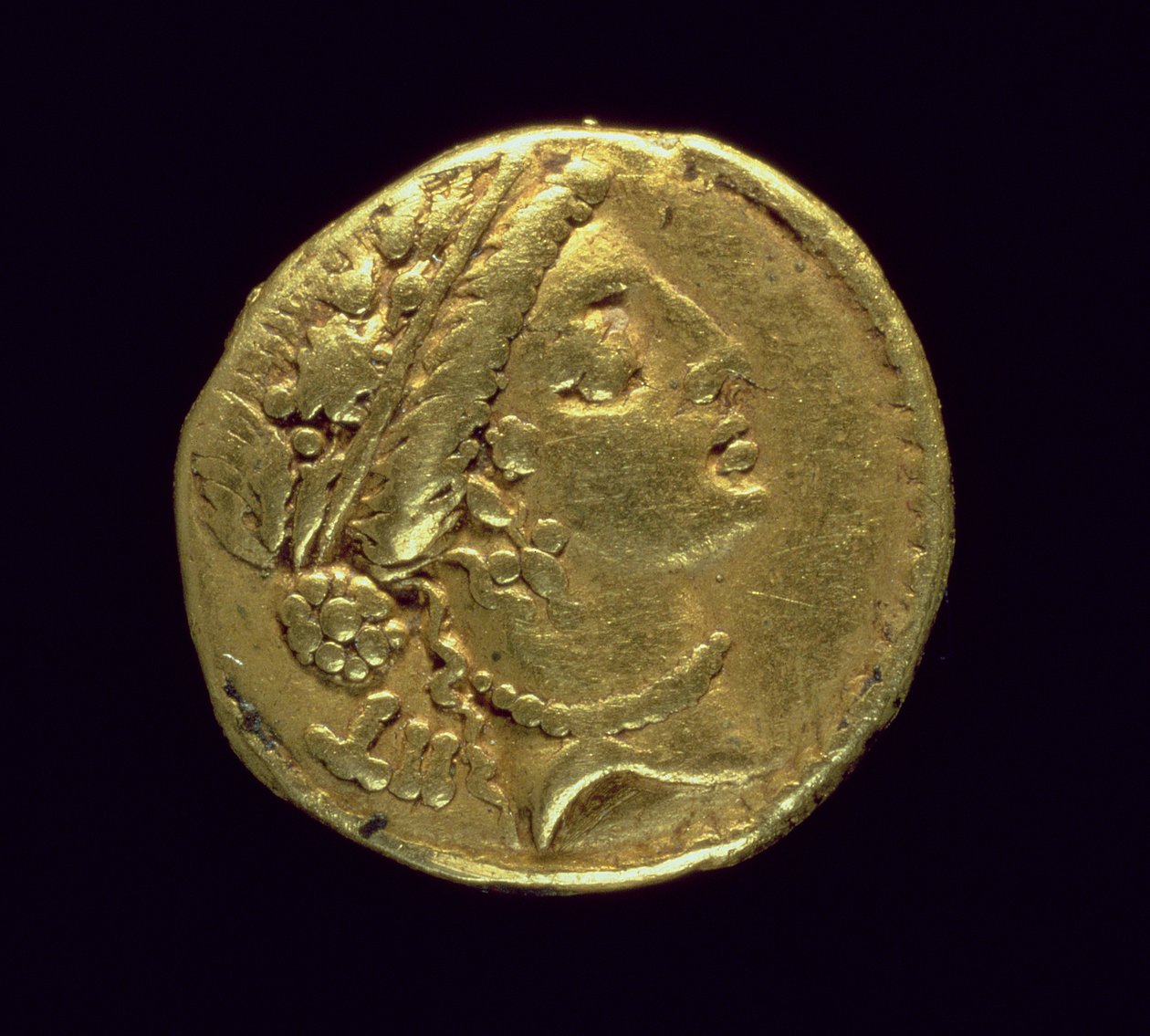 Aureus Minted by Julius Caesar Depicting a Female Head Right Wearing an Oak Wreath and Diadem by Roman