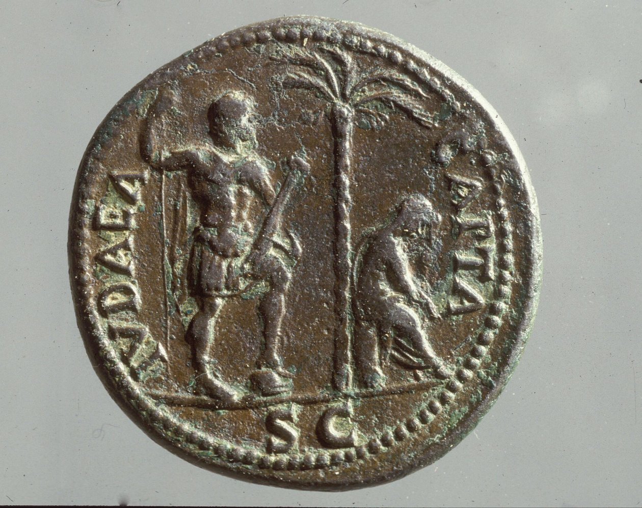 Imperial coin showing mourning figures with the inscription 