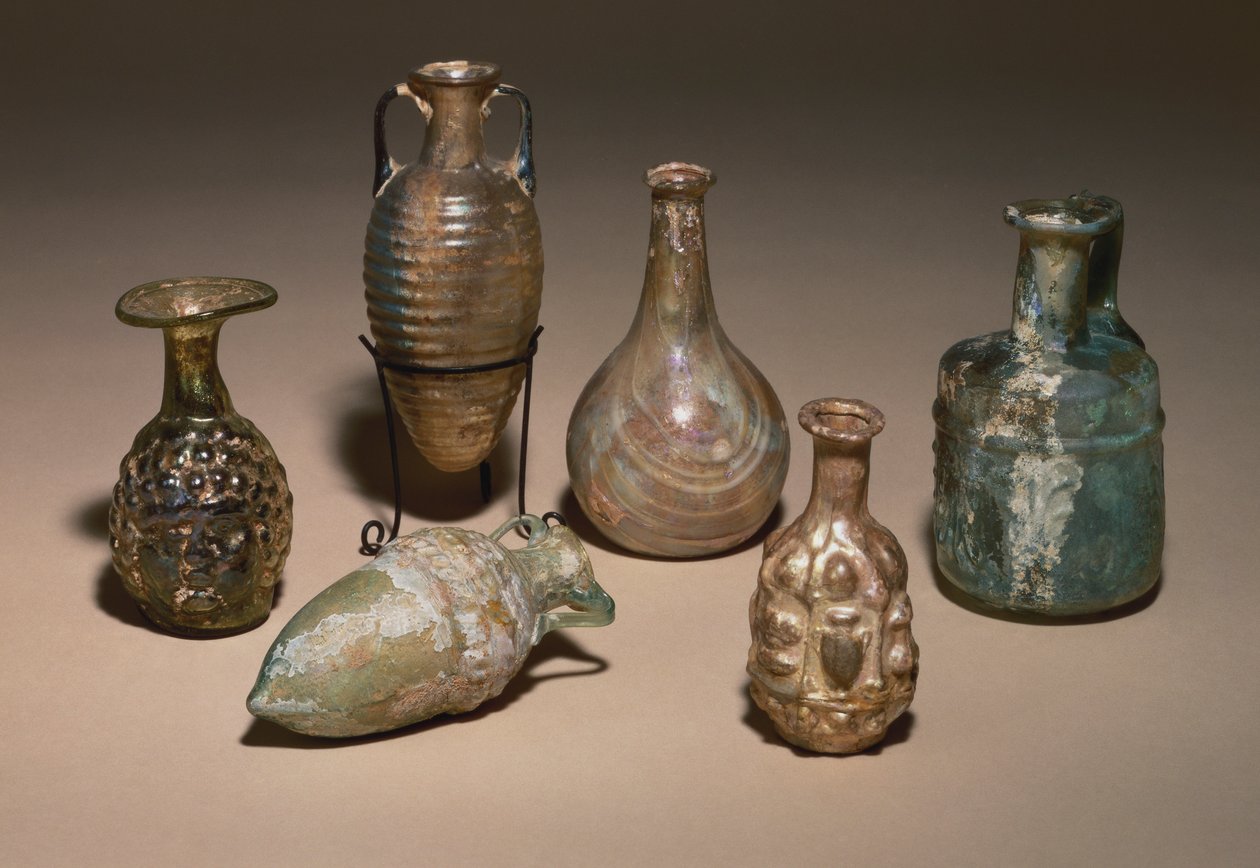 A group of delicate Roman blown and mould blown glass cosmetics flasks, 1st century AD by Roman