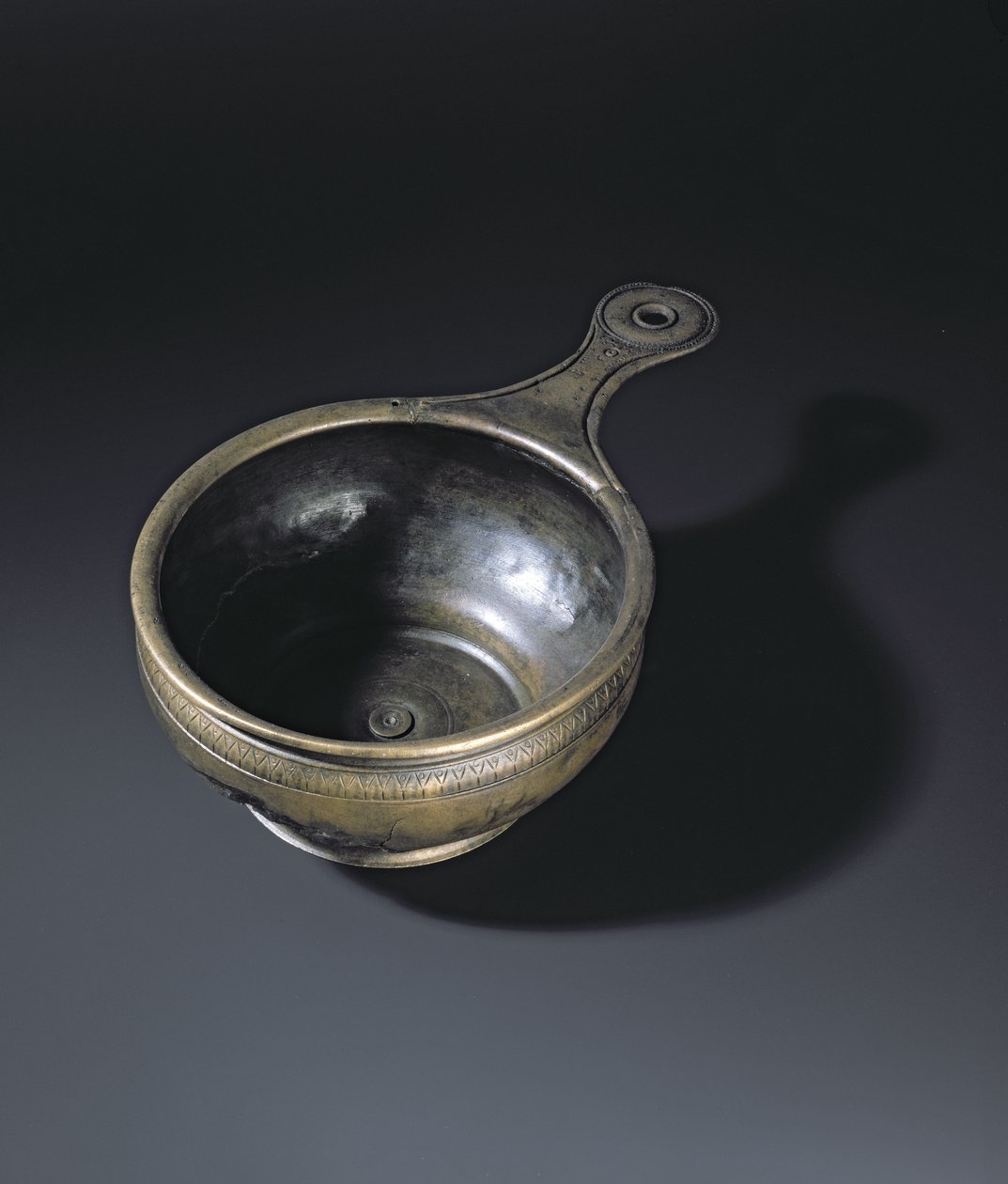Bronze patera ornamented on the bulge, base and handle, from Whitehill, Westruther by Roman