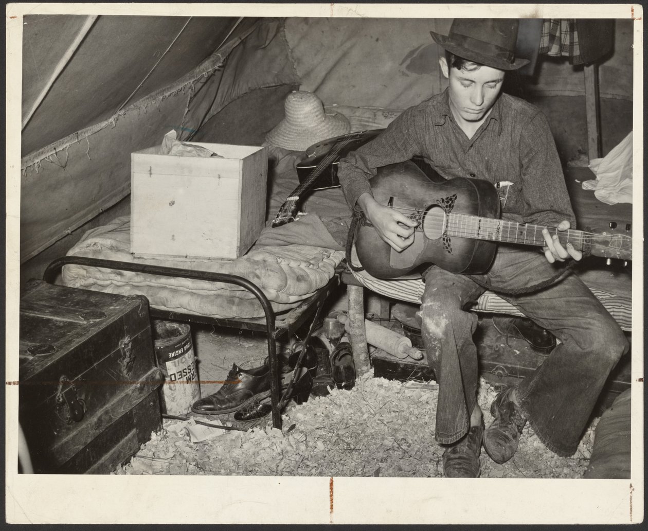 White Migrant Strawberry Picker on Bed in Tent Near Hammond, Louisiana by Russell Lee