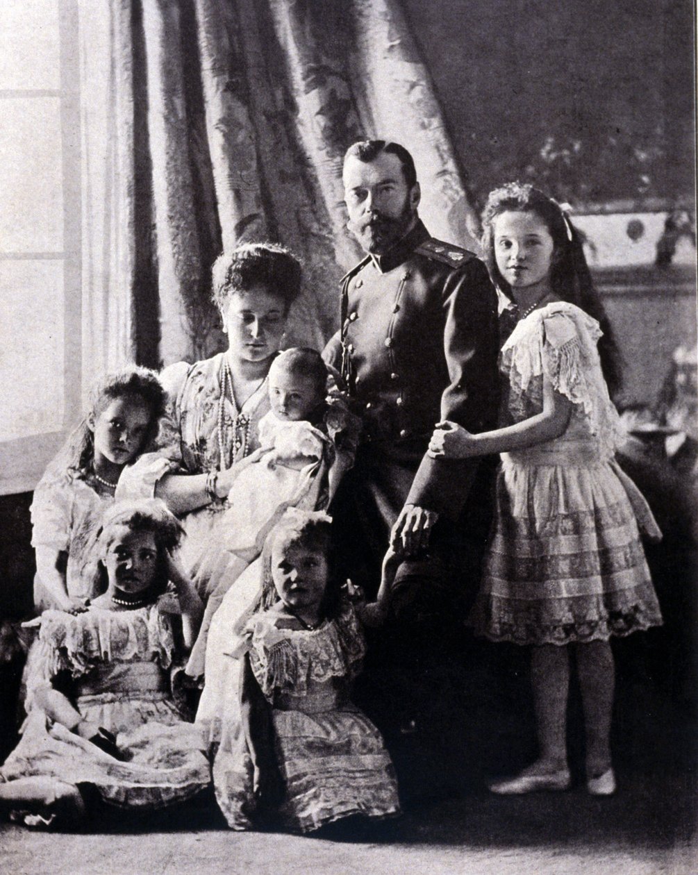 The family of Tsar Nicholas II (1868 - 1918). From left to right: Grand Duchess Tatiana born 11 June 1897; Grand Duchess Mary born 27 June 1899; Grand Duchess Alexis born 12 August 1904; Empress Alexandra Feodorovna; Tsar Nicholas II; Grand Duchess Olga by Russian Photographer